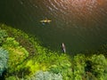 Aerial drone bird`s eye view photo of Happy family with two kids enjoying kayak ride on beautiful river. Little boy and Royalty Free Stock Photo