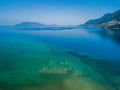 Aerial drone bird`s eye view photo of old Sunken City of Epidauros, Greece