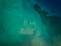 Aerial drone bird`s eye view photo of tourists snorkeling above old Sunken City of Epidauros, Greece