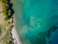 Aerial drone bird`s eye view photo of tourists snorkeling above old Sunken City of Epidauros, Greece