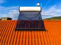 Aerial drone close up of a solar water heater boiler on rooftop