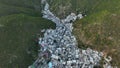 Aerial drone evening shot of Saidpur village surrounded by steep green mountains. Islamabad Pakistan