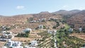 Aerial drone flight towards dry mountain landscape with few houses located on the hill in Tinos,Greece