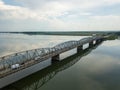 Aerial Drone Flight: View of the bridge over the river with cars.