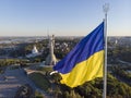 Aerial Drone Flyby Shot in Kyiv - Biggest National flag of Ukraine. Aerial view. Spivoche Pole, Kiev