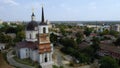 Aerial drone footage of Cherson city, church and houses with green trees Ukraine