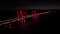 Aerial drone footage of the Gov Mario M. Cuomo Bridge lit in Red at night in NY, USA