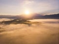 Aerial drone image of Beautiful harmony romantic color sunrise landscape scenery with sunlight and fog and Mount Kinabalu as Royalty Free Stock Photo