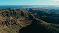 aerial drone image of beautiful stunning landscape cliffs and valleys and Maspalomas and playa ingles in the background on a sunny