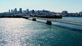 Aerial drone image of montreal with bridges and skyscrapers in the background on the horizon