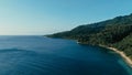 Aerial drone image of a remote south pacific island with sandy beach shore and beautiful ocean sea seascape and lush tropical Royalty Free Stock Photo