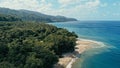 Aerial drone image of a remote south pacific island with sandy beach shore and beautiful ocean sea seascape and lush tropical Royalty Free Stock Photo