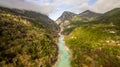 Aerial drone image of a river crossing through mountains