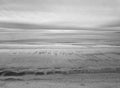 Aerial drone image of the wide expanse of sandy beach on a Kennebunkport Maine Beach in winter