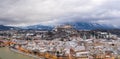 Aerial drone overview of Salzburg old town skyline covered with snow and view of Hohensalzburg in Austria winter Royalty Free Stock Photo