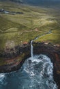 Aerial drone panorama of Mulafossur waterfall, Vagar, Faroe Islands, Denmark. Rough see in the north atlantic ocean