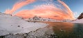 Aerial drone panorama photo. Beautiful sunset over the mountains and sea of the Lofoten Islands. Reine, Norway. Winter landscape w Royalty Free Stock Photo