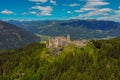 Aerial drone panorama of Steinschloss castle ruins rising above the mura valley in styria, Austria. Medieval ruins in Austria on a Royalty Free Stock Photo