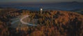 Aerial drone panorama view of a rain radar or meteorological doppler radar for measuring precipitation in early morning hours