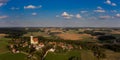 Aerial drone panorama of the village Eichlberg near Hemau with church of pilgrimage and surrounding rural area on top of a hill in