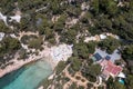 Aerial drone photo of a beach known as Cala Gracioneta in the town of Sant Antoni de Portmany on the island of Ibiza in the Royalty Free Stock Photo