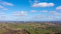 Aerial drone photo of the beautiful town of Thornton in Bradford in the UK showing the farmers fields in the Spring time on a hot Royalty Free Stock Photo