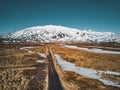 Aerial drone photo of a empty quit road road towards a huge volcanic mountain Snaefellsjokull in the distance, near