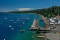 An aerial view of a boat dock and the mountains along Lake Tahoe's west shore