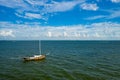 Aerial drone photo of an old rusted sailboat abandoned in a bay