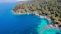 Aerial drone photo of pleasure yacht anchored in crystal clear bay and turquoise beach. uninhabited island in Royalty Free Stock Photo
