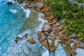 Aerial drone photo of stony part of beautiful anse cocos beach at La Digue, Seychelles