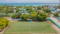 Aerial drone photo view of the football pitch at the Maamigili tropical island at the Alif Dhaal Atoll at the indian ocean