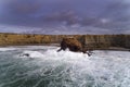 Aerial drone photo of the waves crashing against the rocks in the beautiful coastline along the Vicentine Coast, near the Bordeira Royalty Free Stock Photo