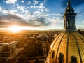 Aerial Drone Photograph - Stunning golden sunset over the Colorado state capital building & Rocky Mountains, Denver Colorado. Royalty Free Stock Photo