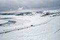 Aerial landscape with a car on the winter road