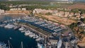 Aerial drone point of view Port Adriano docked yachts vessels in row, sunny summer day