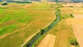 Aerial drone shoot. Flying over a beautiful green forest in a rural landscape. Top view of trees in forest background. Drone