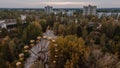 Aerial drone shot of the abandoned attraction park with feris wheel at Pripyat ghost town