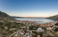 Aerial drone shot of adriatic sea Komiza town on Vis Island with view of Bisevo Island in Croatia summer sunrise Royalty Free Stock Photo