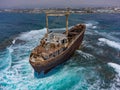 Aerial drone shot of cargo shipwreck in Paphos with waves Cyprus island storm Mediterranean sea Royalty Free Stock Photo