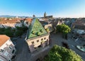 Aerial Drone Shot of the city of Colmar in Alsace France. Green shingles of Koifhus. Quiet streets at sunny Morning.