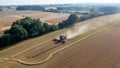 Aerial drone shot of a Claas 8900 harvester combine harvesting the field