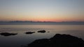 Aerial drone shot of the dramatic sunset and the sea near Hamaroy, Nordland, Norway