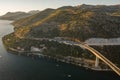 Aerial drone shot of Dubrovnik bridge west part connecting highway in Croatia summer sunset