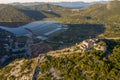 Aerial drone shot of Fortress of City of Ston on top of hill with view of Salt Pans in Croatia sunrise