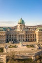 Aerial drone shot of front facade of Buda castle palace complex during Budapest morning sunrise