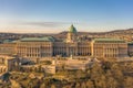 Aerial drone shot of front facade of Buda castle palace complex during Budapest morning sunrise Royalty Free Stock Photo