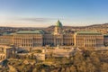 Aerial drone shot of front facade of Buda castle palace complex during Budapest morning sunrise