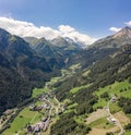 Aerial drone shot of Helligenblutt village in with view of Grossglockner mountain in Austria