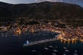 Aerial drone shot of Komiza town port in night with city light on Vis Island in Croatia summer dusk